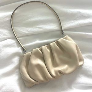 STAUD Bean Ruched Bag in cream.